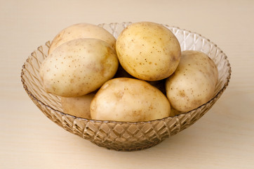 Fresh potatoes in a vase