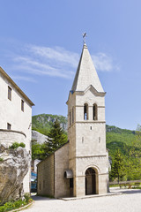 Fototapeta na wymiar Bell tower of Holy Trinity Church. Monastery Ostrog. Montenegro