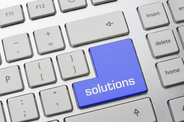 blaue Taste auf Tastatur:  SOLUTIONS