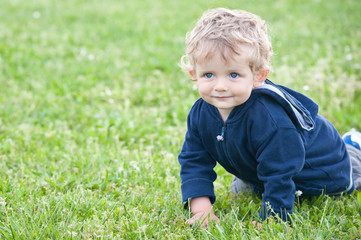 One year boy playing in the park portrait.