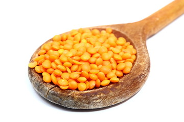 red lentil in wooden spoon