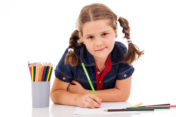 Cute child draw with colorful crayons and smile, isolated over w