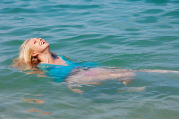 Girl swims in the sea