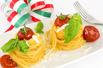 nests of spaghetti with tomato, basil and parmesan