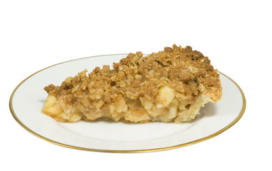 fresh apple crumble cake on a plate, isolated