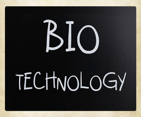 "Bio technology" handwritten with white chalk on a blackboard