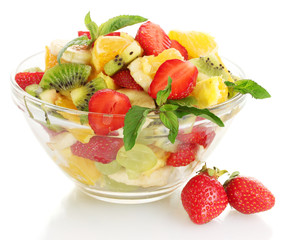 glass bowl with fresh fruits salad and berries isolated on