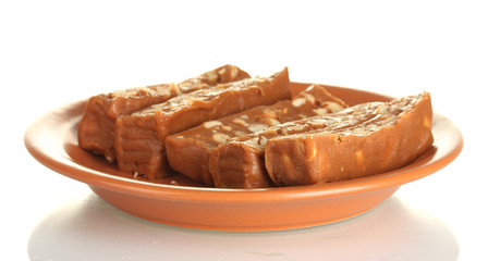 Cut east sweets - sherbet with nuts in the plate isolated