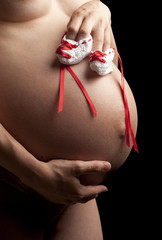 Pregnant woman with white bootees