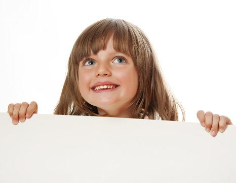 little girl holding  white board with empty space