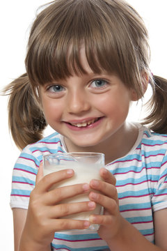 little girl with glass of milk