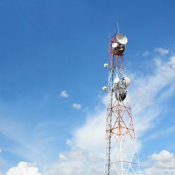 Modern cell and antenna pole on blue sky
