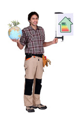 Fototapeta premium Man holding a globe and a sign for energy consumption