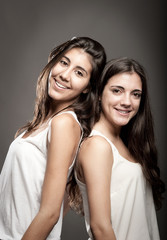 sisters back to back