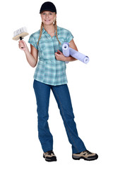 Woman putting up wallpaper