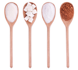 Wooden spoons with sugar, lump sugar, salt, cocoa