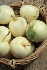 Fresh apples in a wicker basket