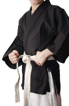 Boy in Black kimono and a white belt, isolated on white