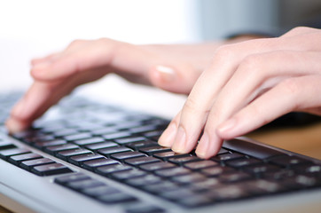 Hands typing on the keyboard