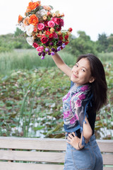 woman face holding bouquet flowers in hand