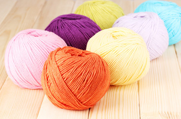 Knitting yarn on wooden background