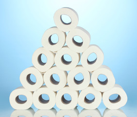 rolls of toilet paper on blue background