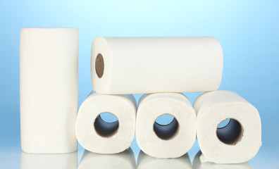 rolls of toilet paper on blue background