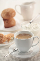 Breakfast with a cup of coffee and cottage cheese