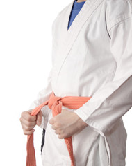 White kimono and an orange belt.