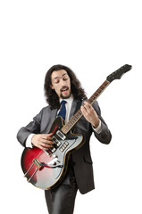 Obraz premium Guitar player in business suit on white