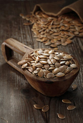 Pumpkin seeds in a wooden laddle