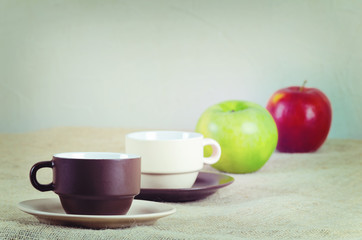 Cups and apples