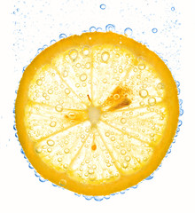 close-up of lemon slice in clear water with bubbles