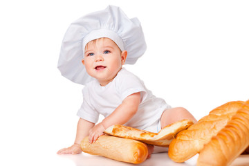 Little boy in a cap and with bread
