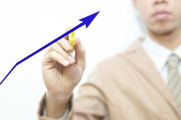 Business man pointing a growing graph on the screen background