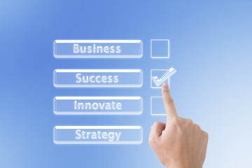 Business man pointing checked box on the screen background