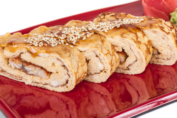 Omelet Maki Sushi - Roll made of Smoked Eel inside. Topped with