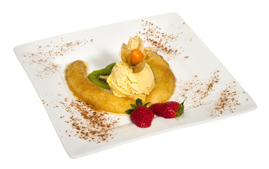 Dessert of banana, ice-cream, caramel, strawberry and mint