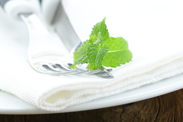cutlery, fork and knife on a white plate