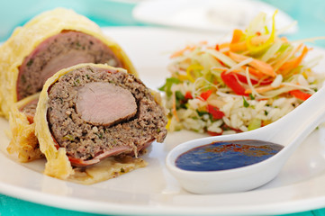 meal with prepared meat rolled and vegetables
