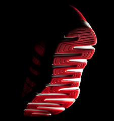Sneaker sole, view of a falling foot from below..