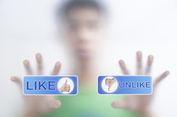 finger pressing Social Network icon on like button