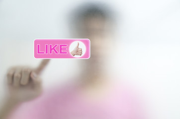 Man put finger pressing Social Network icon on like button