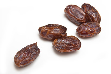 Medjool dates isolated on a white studio background.