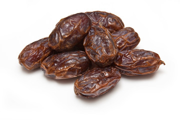 Medjool dates isolated on a white studio background.