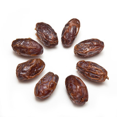 Medjool dates isolated on a white studio background.