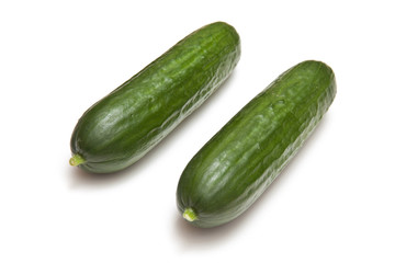 Mini Cucumbers isolated on a white studio background.