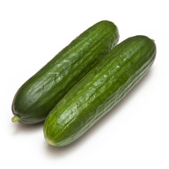 Mini Cucumbers isolated on a white studio background.