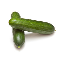Mini Cucumbers isolated on a white studio background.