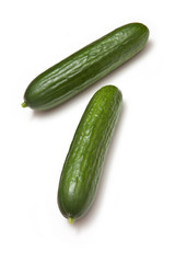 Mini Cucumbers isolated on a white studio background.